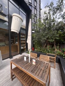 Vela Studio café cup display at the entrance in Thong Lor, Bangkok.