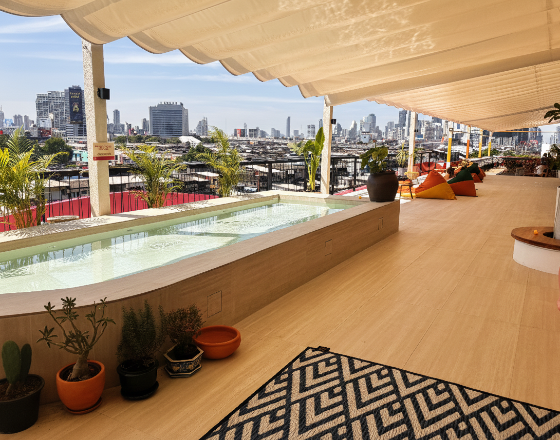A sunny outdoor pool deck with crystal blue water, showing premium Eban brand bags arranged by the poolside under natural light.